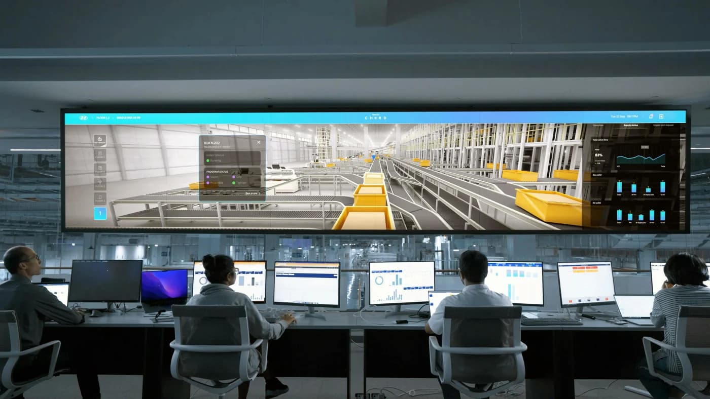 Robotics engineers testing a production system